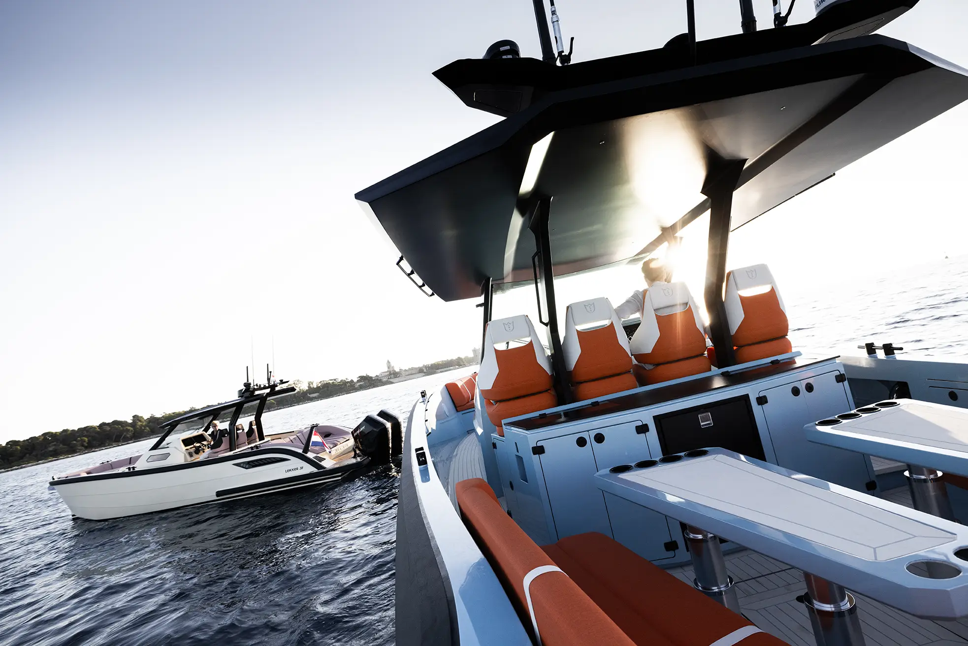 Lekker 45 at anchor, guests enjoying the swim platform