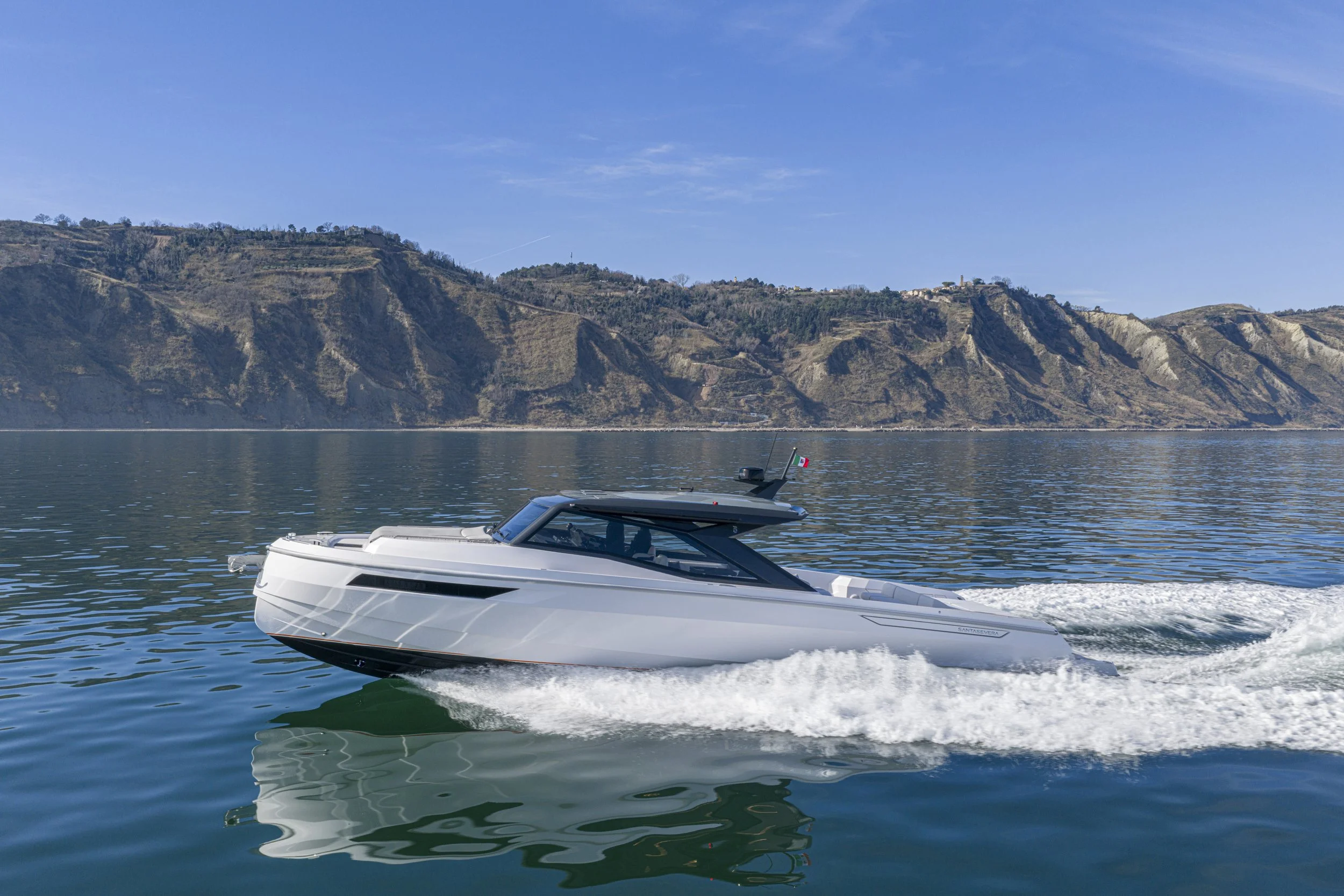 Santasevera 52 motorboat underway on calm water, white hull, side-quarter view