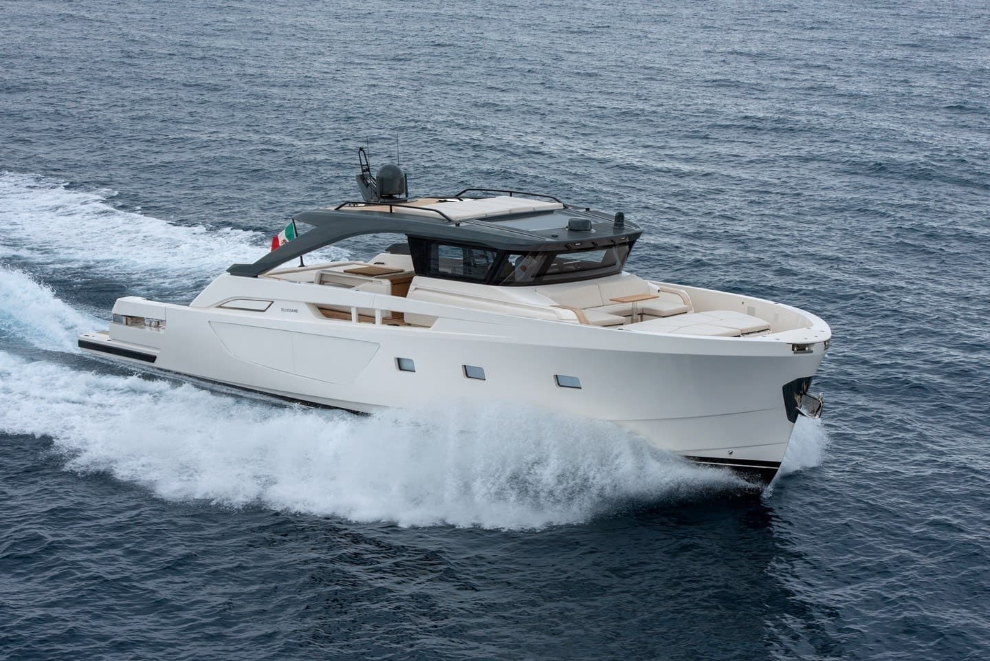Bluegame BG74 exterior port-side view underway at sea